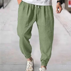 Casual men's summer green pants detail, breathable loose cuffed design for daily wear.