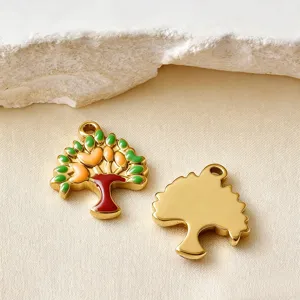 Macro view of colorful enamel tree charms showing detailed front and smooth gold back