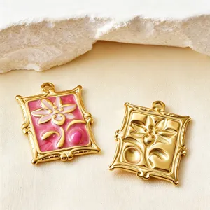Detailed close-up of gold-plated stainless steel flower pendants with pink enamel finish.