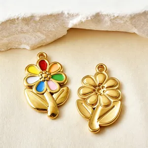 Close-up detail of colorful enamel and gold-plated stainless steel flower charms for DIY jewelry