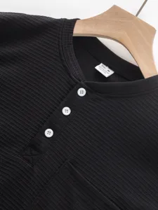 Black ribbed henley shirt detail view, long sleeve button collar men casual top.