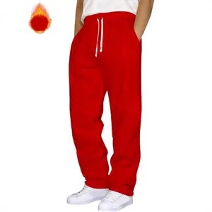 Casual red sweatpants for men and women, loose fit joggers with white drawstring details.