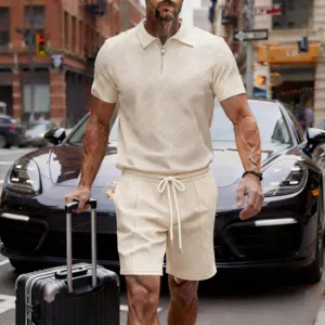 Men's casual knit short sleeve zip polo shirt and matching shorts set in solid beige color.
