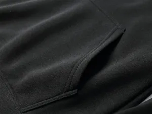 Detailed view of the black hoodie pocket, soft fabric and neat stitching for daily wear.