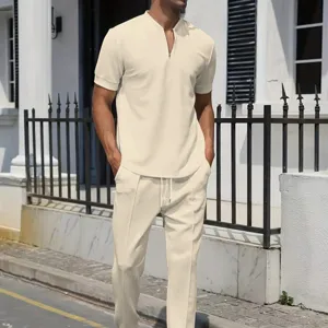 Men's waffle knit short sleeve zip polo shirt and casual pants set in beige detail view.