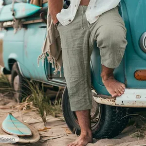 Detailed view of casual men's cropped beach pants with drawstring and loose straight fit.