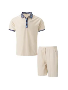 Men's summer casual waffle polo shirt and shorts set with patterned trim in beige color.