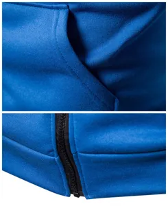 Close-up detail shot of blue hoodie fabric, pocket stitching and premium black zipper.