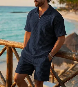 Men summer waffle knit polo shirt and shorts resort set detail view in classic navy blue.