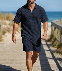 Detailed view of men's casual waffle knit short sleeve polo and shorts set for summer resort style.