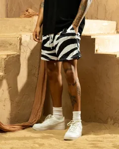 Detailed close-up view of men's black and white zebra print mesh athletic training fitness shorts.
