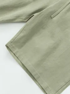 Detail fabric and clean stitching close-up view of men's summer casual linen shorts.