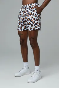 Detailed view of men's athletic mesh shorts featuring a bold leopard print and drawstring waist.