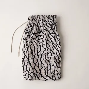 Detailed view of men mesh athletic shorts with trendy print design for fitness and sports training.