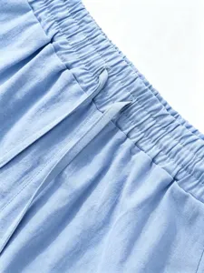 Men's casual linen shorts detail view, breathable cotton blend fabric with elastic drawstring waist.