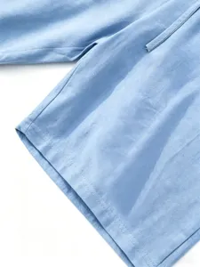 Men's casual linen shorts detail view, breathable cotton blend fabric with clean fine stitching.