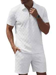 Detail view of white jacquard polo shirt and shorts set for men, textured fabric close-up.
