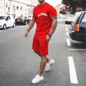 Detail shot of a casual men red short sleeve t shirt and shorts matching set on street.