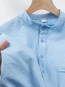 Light blue textured short sleeve mandarin collar shirt detail, breathable waffle fabric texture.