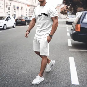Detailed view of men's casual white short sleeve t-shirt and shorts set showcased in street scene.