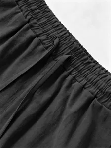Close-up detail of mens summer casual cotton linen shorts elastic waistband with drawstring.