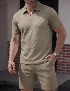 Close-up detail of men's knit polo shirt and shorts set with textured diamond jacquard design.