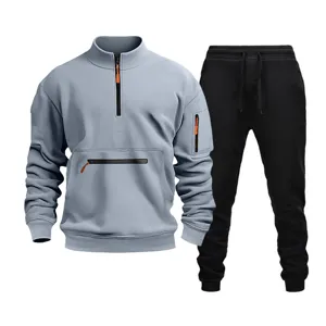 Detail view of the casual men's half-zip sweatshirt and black sweatpants tracksuit set.