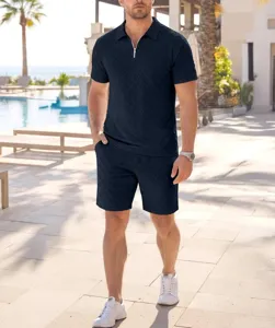 Men's navy blue jacquard polo shirt and shorts set, casual summer resort wear outfit.