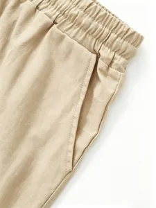 Men's casual linen shorts waistband and pocket detail close-up, breathable fabric, khaki.