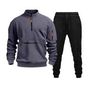 Men's casual tracksuit set featuring a grey half-zip sweatshirt and black joggers with pockets.