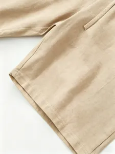 Men's casual linen shorts fabric detail shot, khaki color, breathable and lightweight.