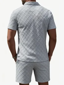 Detailed back view of men light grey textured jacquard short sleeve polo shirt and shorts set.