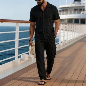 Detailed view of the men linen two piece set short sleeve shirt and cargo pants in black.