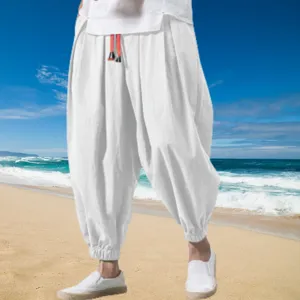 Men's loose cotton linen harem pants casual summer beach trousers with elastic cuffs and drawstring.