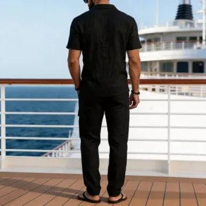 Detailed back view of men's casual black cotton linen short sleeve shirt and long pants set.