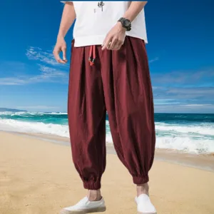 Men's casual cotton linen harem trousers detail, breathable fabric with elastic cuffs.