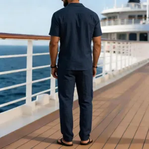 Detailed back view of men's casual linen short sleeve shirt and long pants two piece outfit.