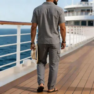 Detail view of men's casual linen short sleeve shirt and long pants two-piece set on deck.