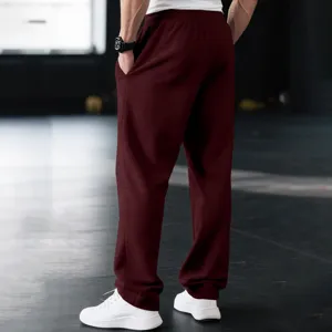 Detailed view of men's casual loose sweatpants in burgundy, comfortable fit for daily wear.