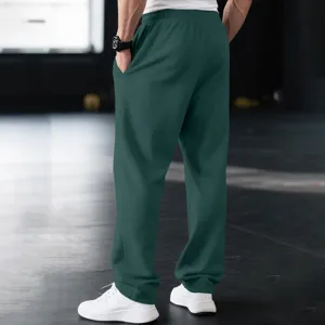 Men's casual loose sweatpants in dark green, comfortable fit for daily commute and sports.