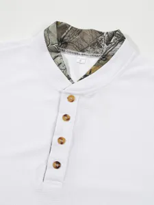 Waffle knit henley collar detail of men long sleeve shirt with camo lining and buttons.