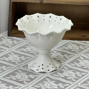 White ceramic footed dessert cup with hollow carved lace edge for ice cream and pudding