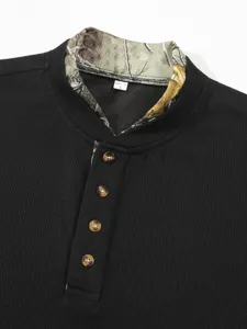 Close-up detail of the waffle knit henley collar, camouflage contrast neck, and buttons.