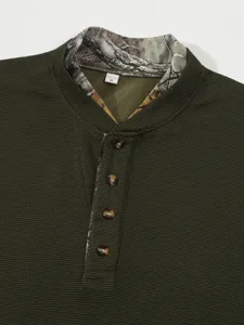 Men's green waffle knit long sleeve Henley shirt collar and button detail view