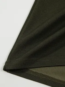 Close-up of men's waffle long sleeve t-shirt fabric texture and hem stitching details.