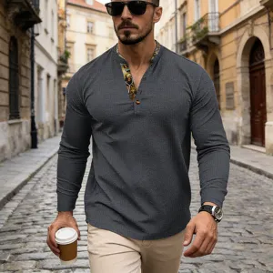 Detailed view of men waffle knit long sleeve henley shirt with contrast collar and buttons.