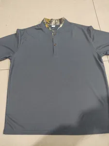 Detailed view of grey waffle knit Henley t-shirt featuring stylish camo collar and buttons