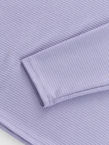 Close-up detail of men's casual long sleeve t-shirt ribbed fabric texture in light purple color.