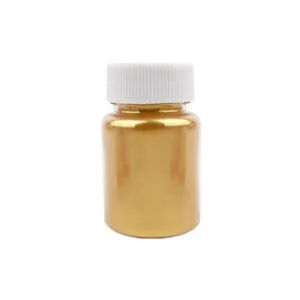 Gold powder bottle detail view, compact cylindrical container with white cap for decorating.