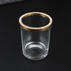 Barattolo in vetro trasparente con bordo in strass dorato, ideale per dettagli posate.